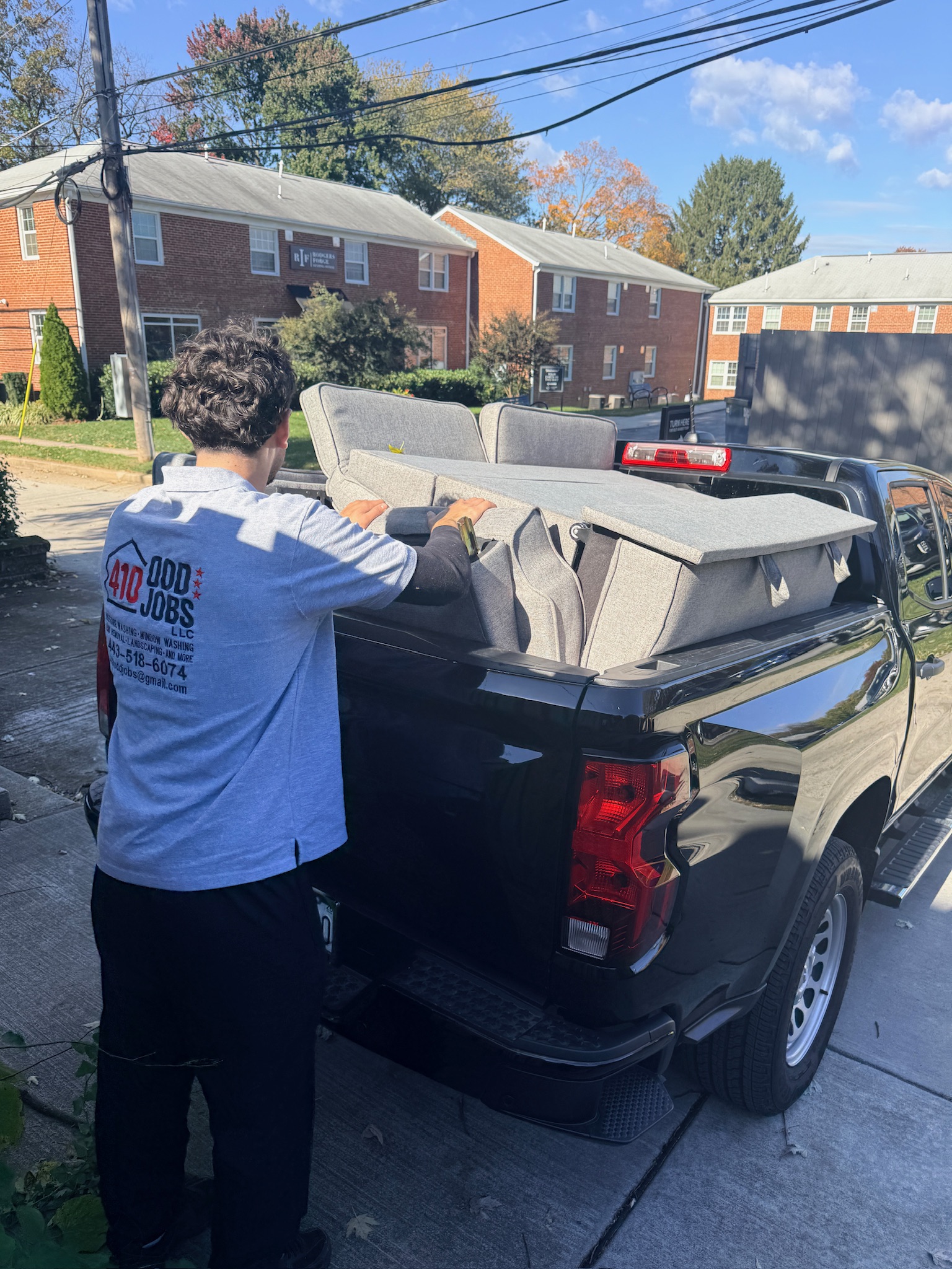 Ahmad loading furniture into truck