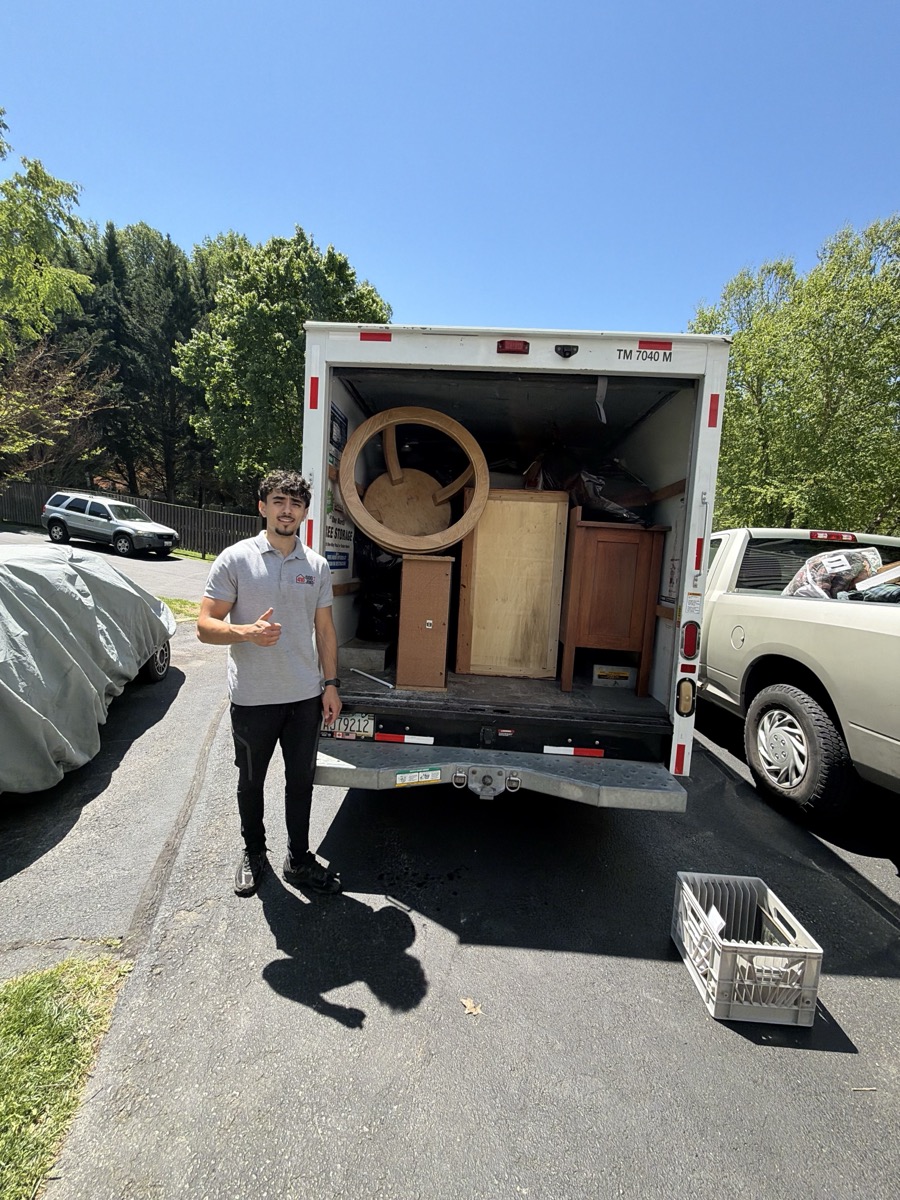 Ahmad with a box truck full of furniture